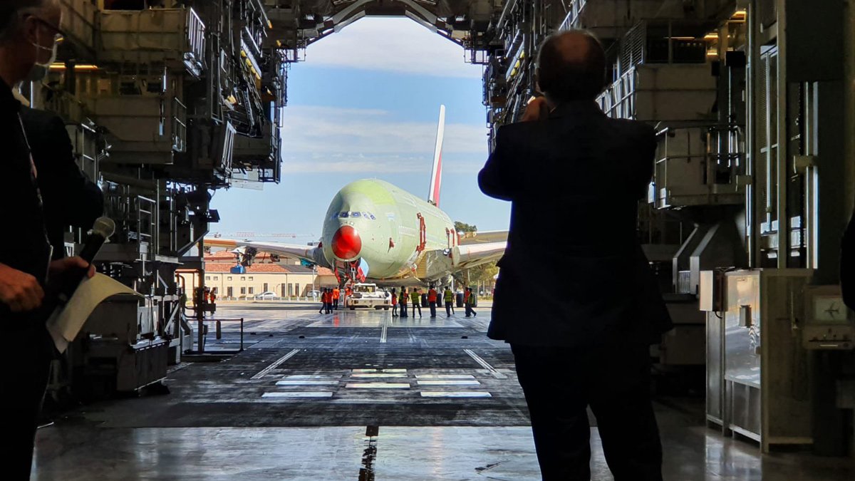 a man taking a picture of an airplane