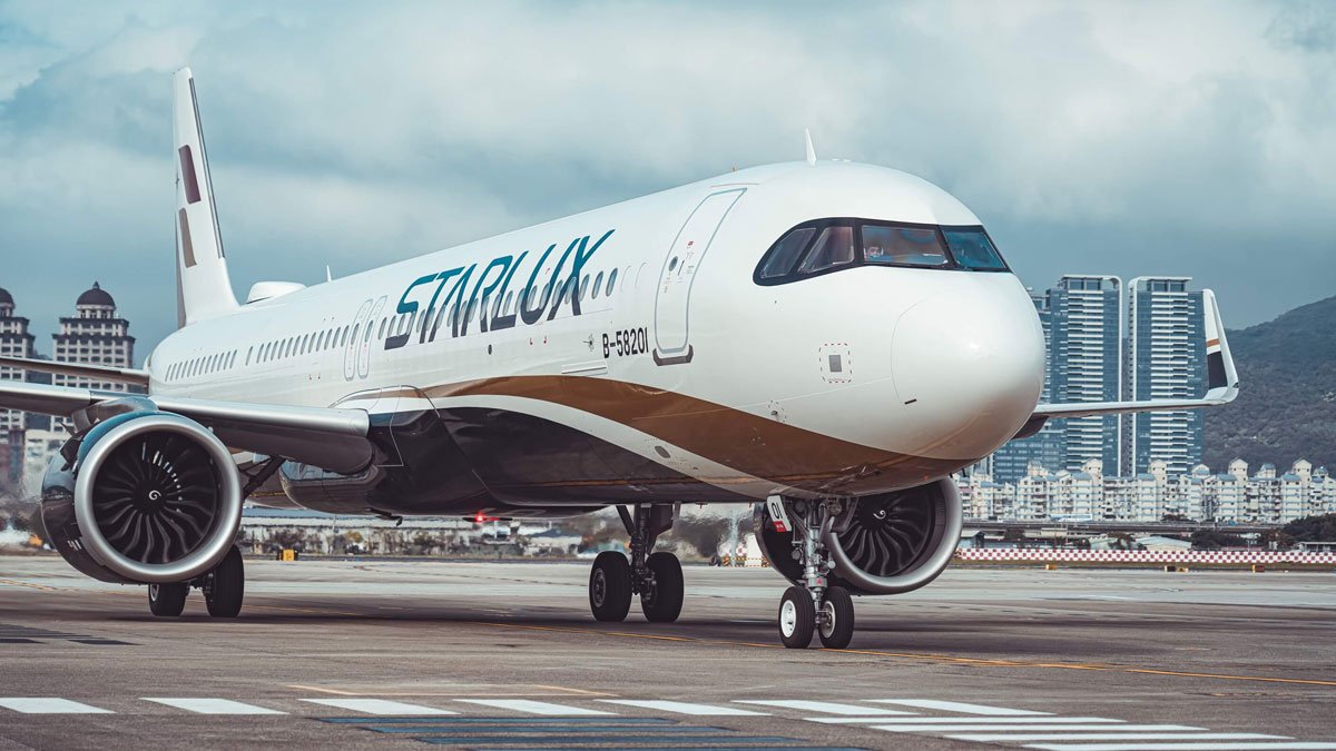 a white airplane on a runway