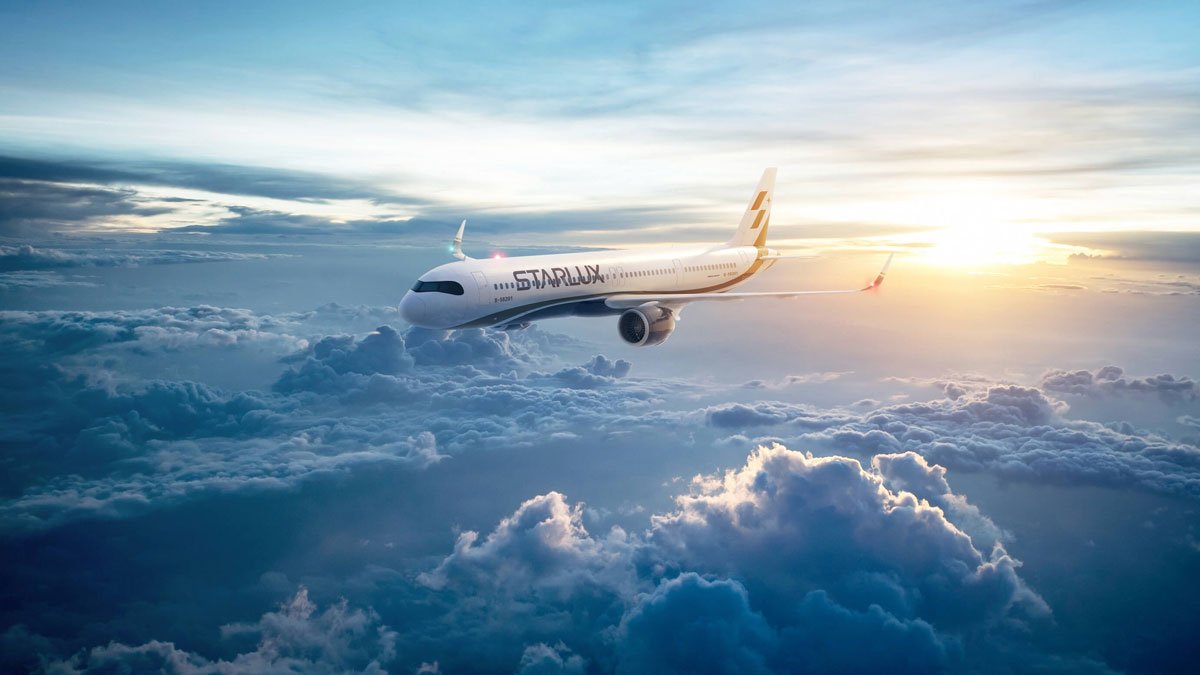 an airplane flying above the clouds