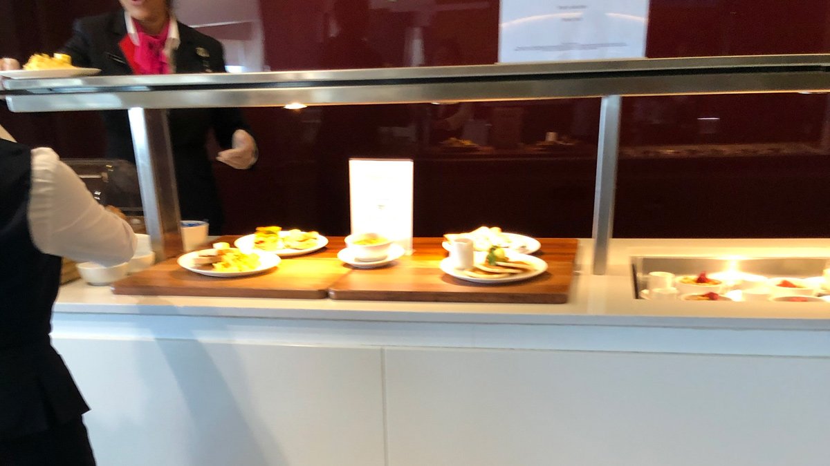 a buffet with plates of food on a counter