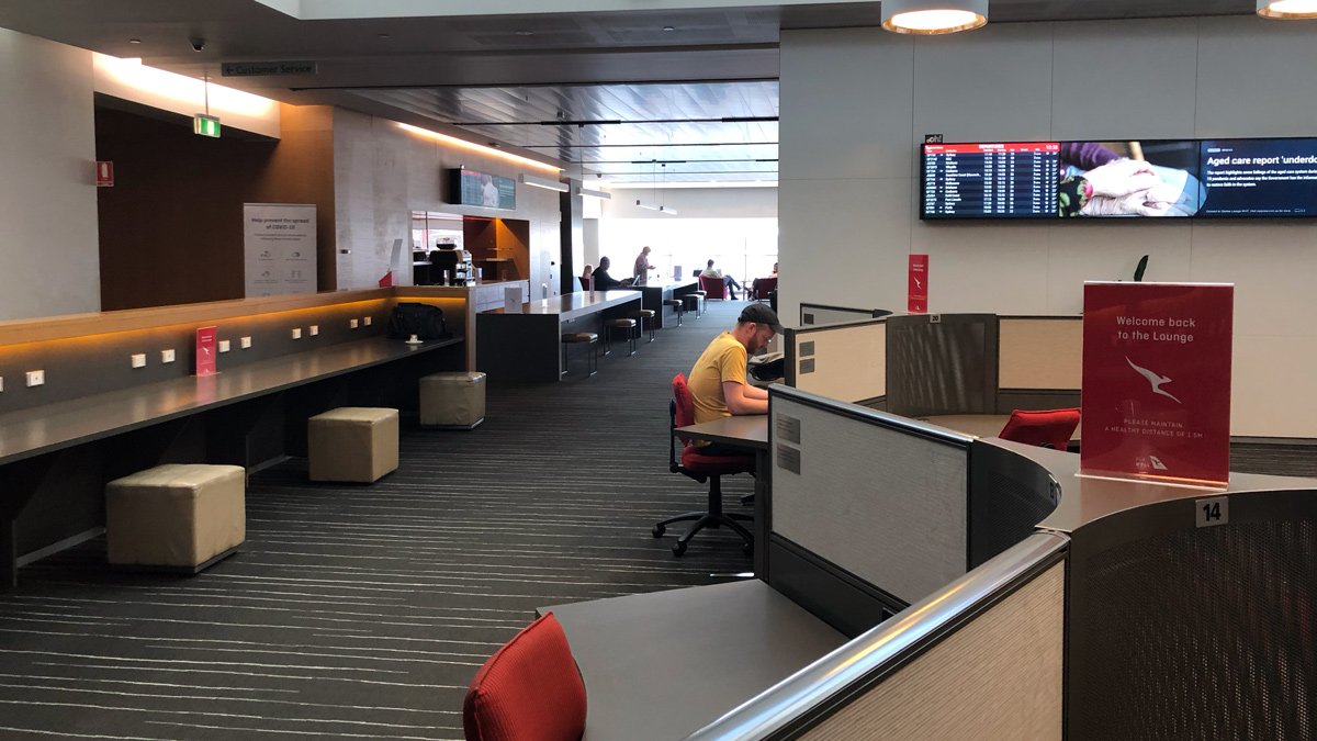 a man sitting at a desk in an airport