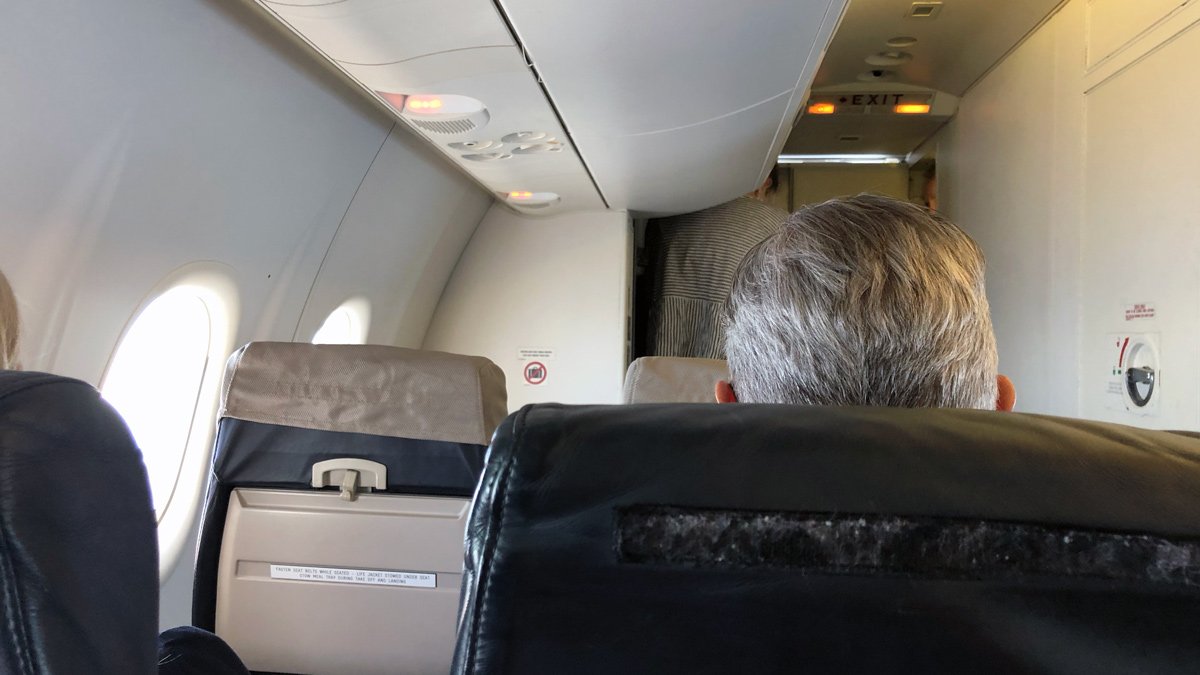 a man sitting in an airplane