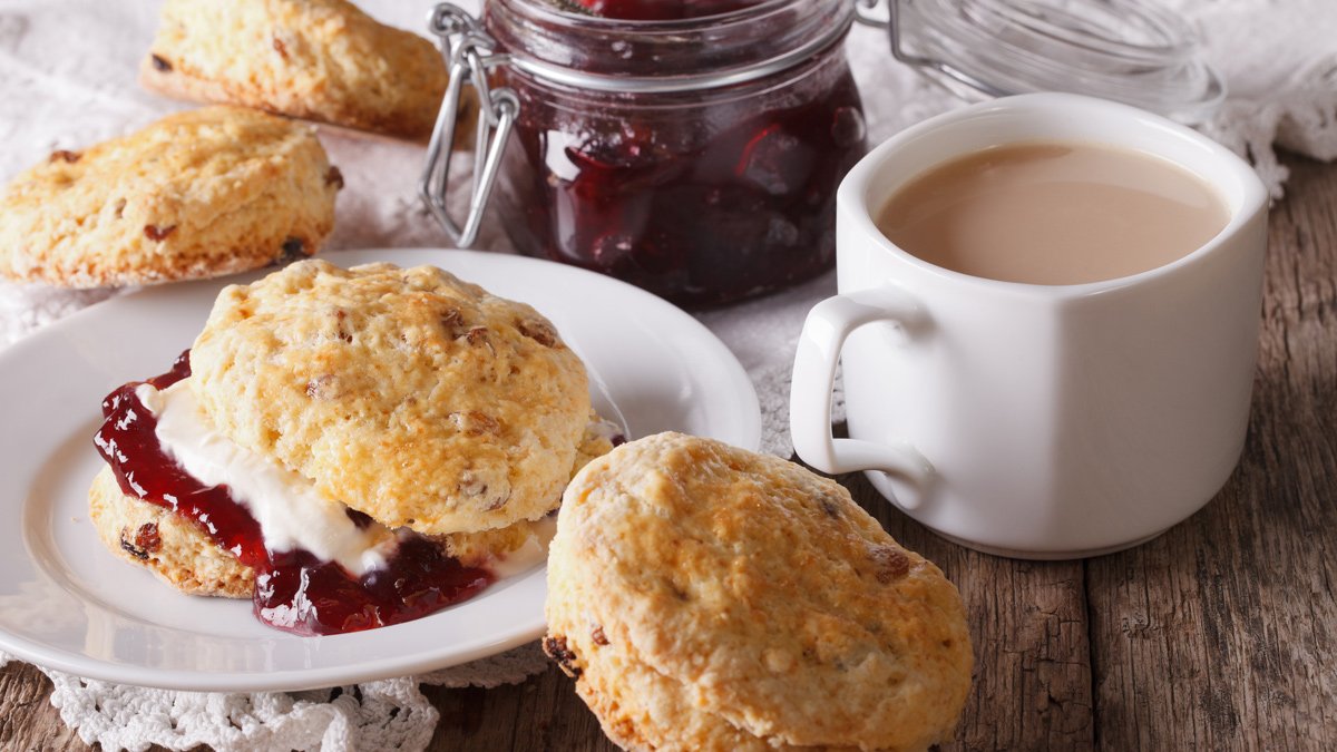 a plate of biscuits and a cup of coffee