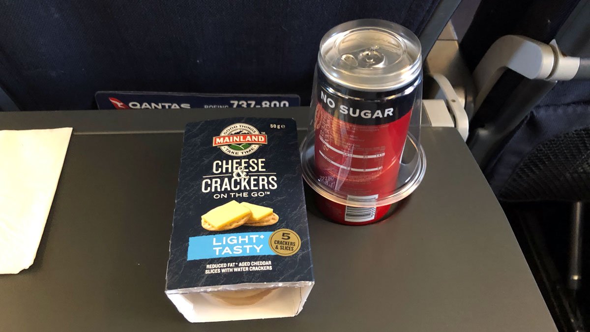 a can and a box of crackers on a table