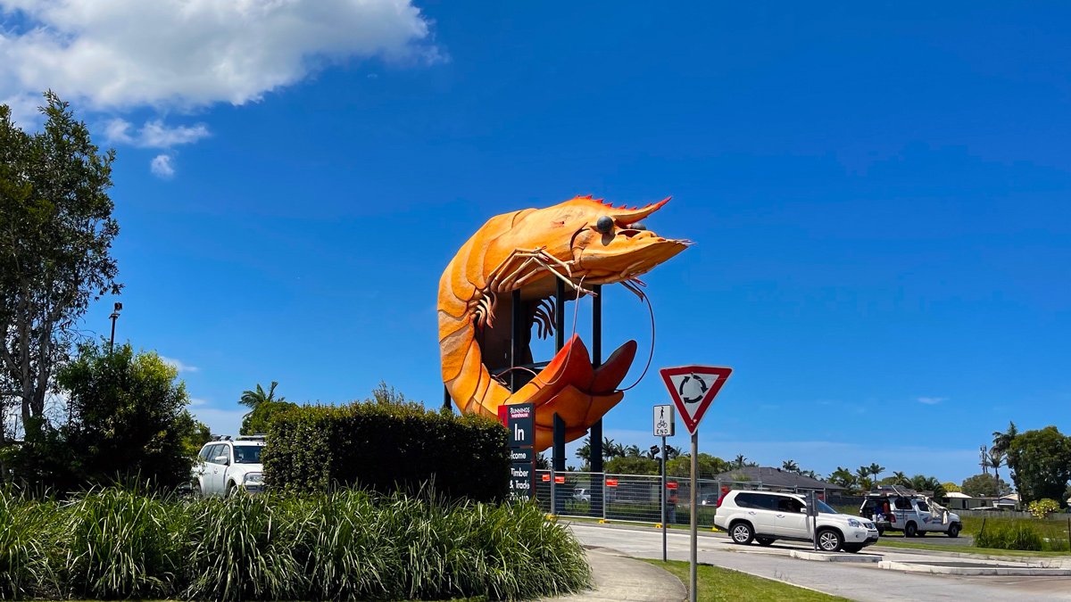 a large orange shrimp statue