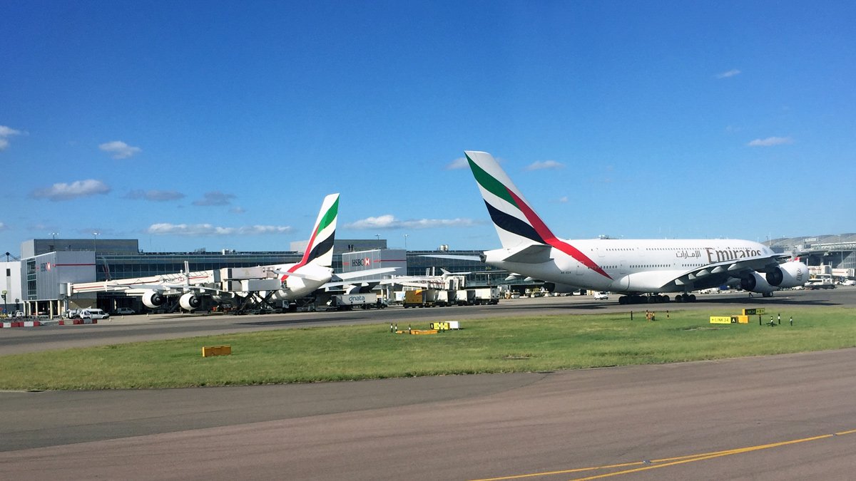 a group of airplanes on a runway