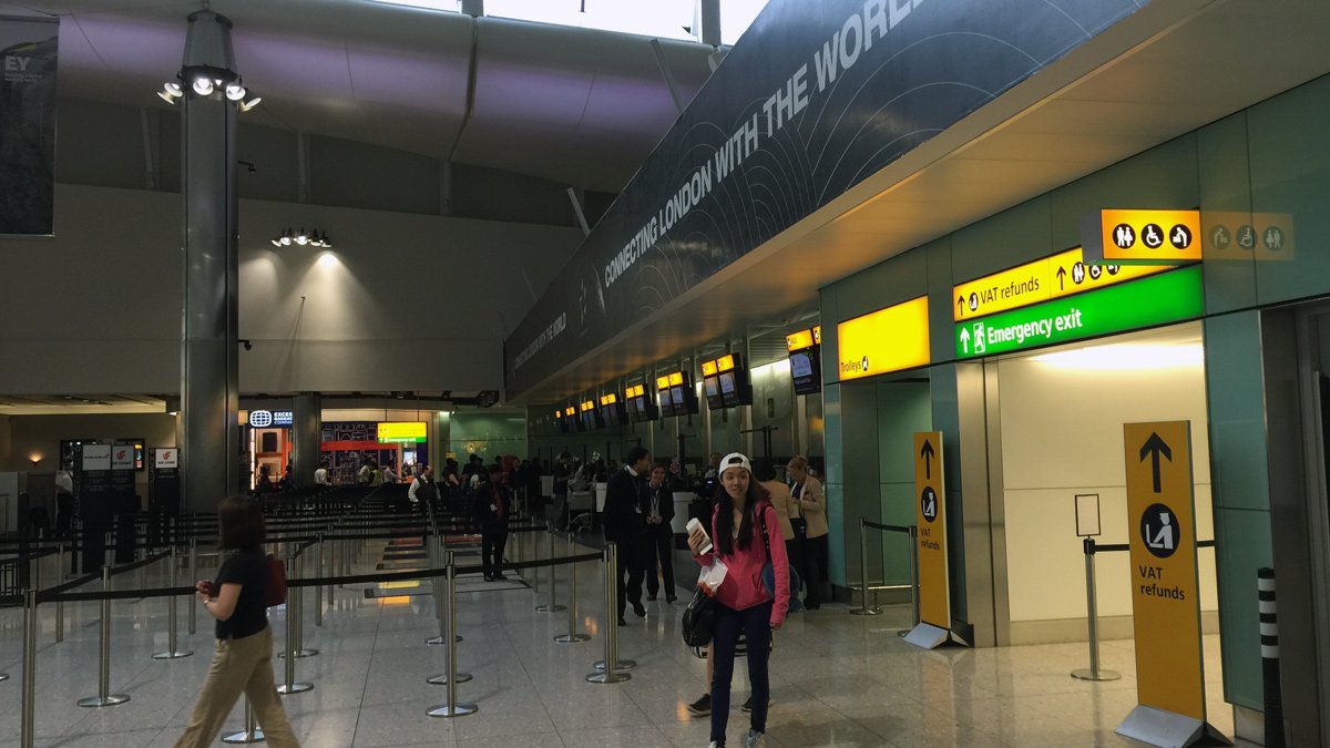 a woman standing in a terminal