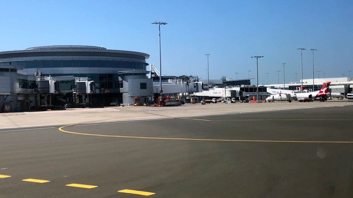 a building with a round building and a runway