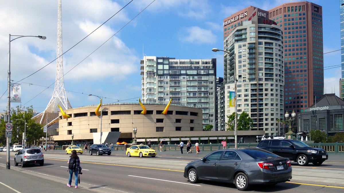 a street with cars and buildings