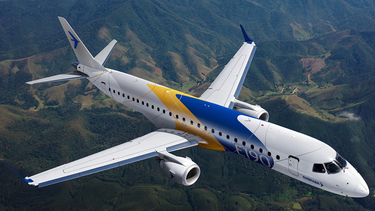 a plane flying over a valley