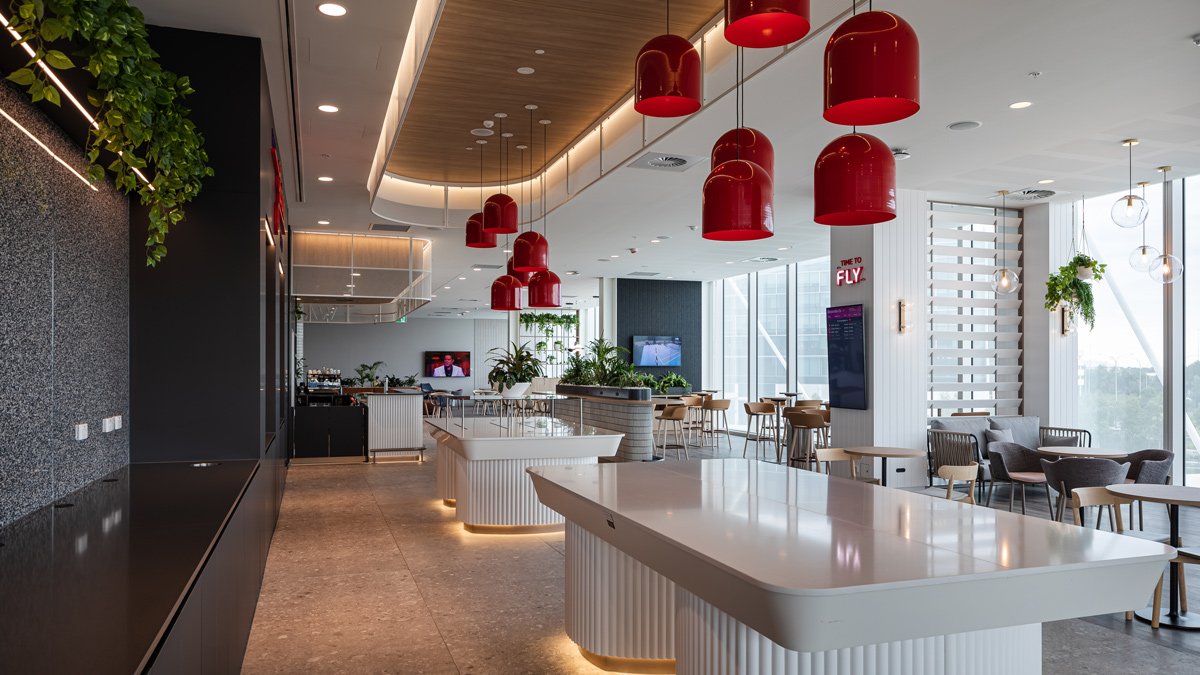 a room with a large counter and red lights