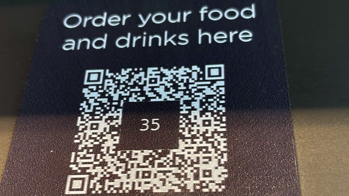 a qr code on a black surface