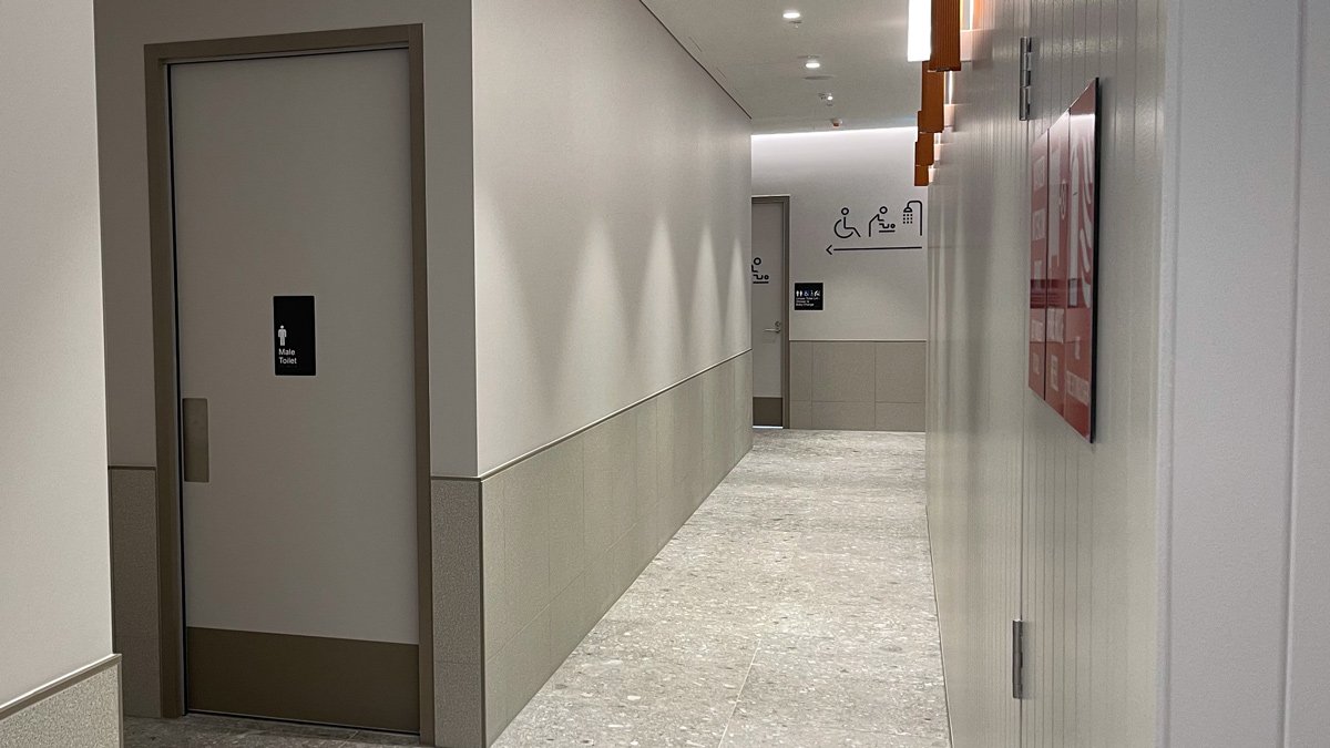 a hallway with a door and signs