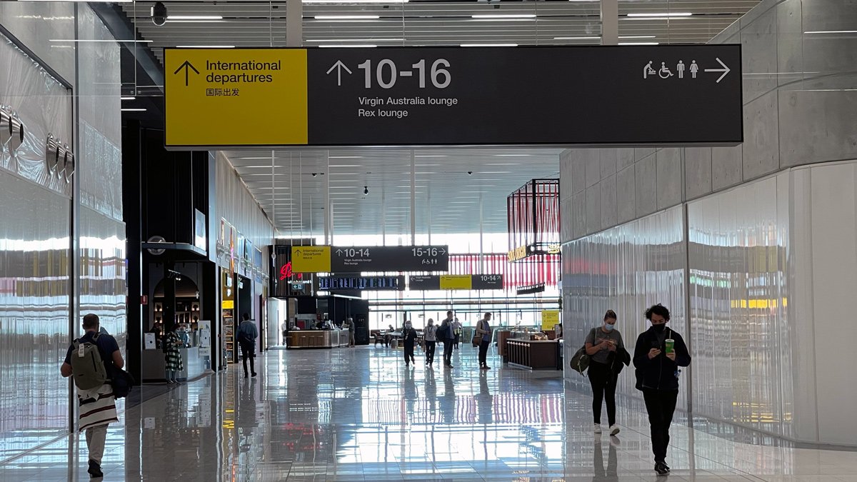 people in a large airport terminal