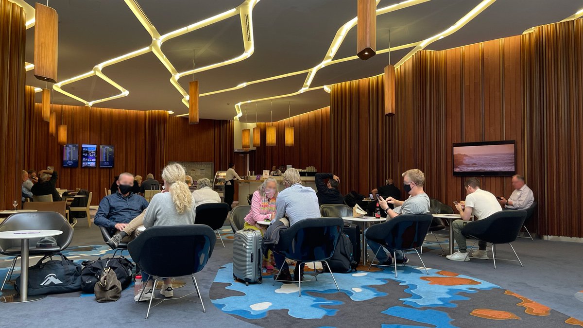 a group of people sitting in chairs in a room