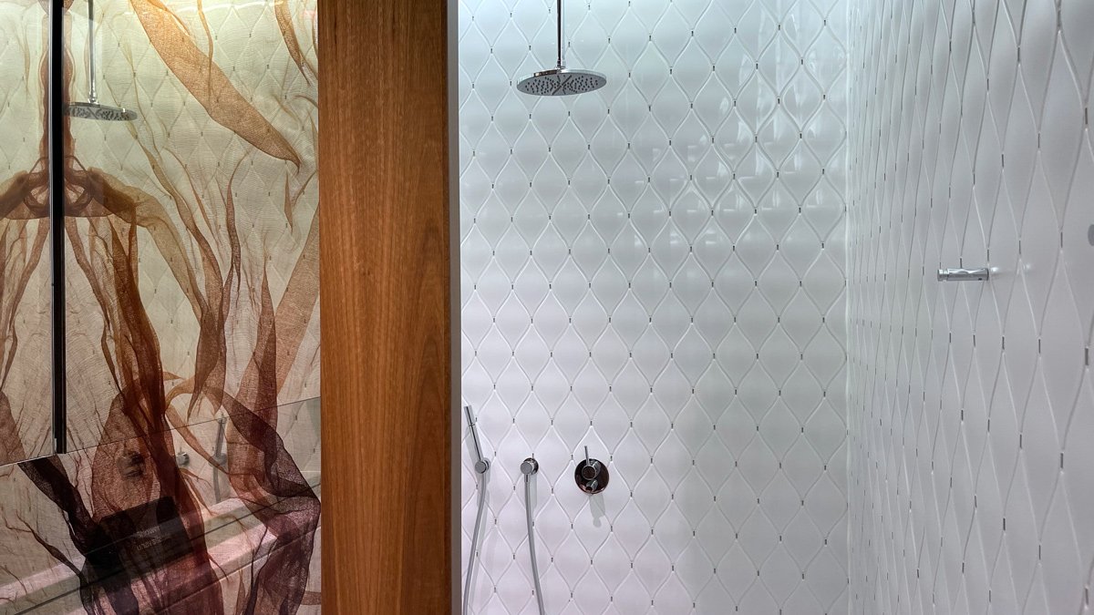 a shower with a wood door