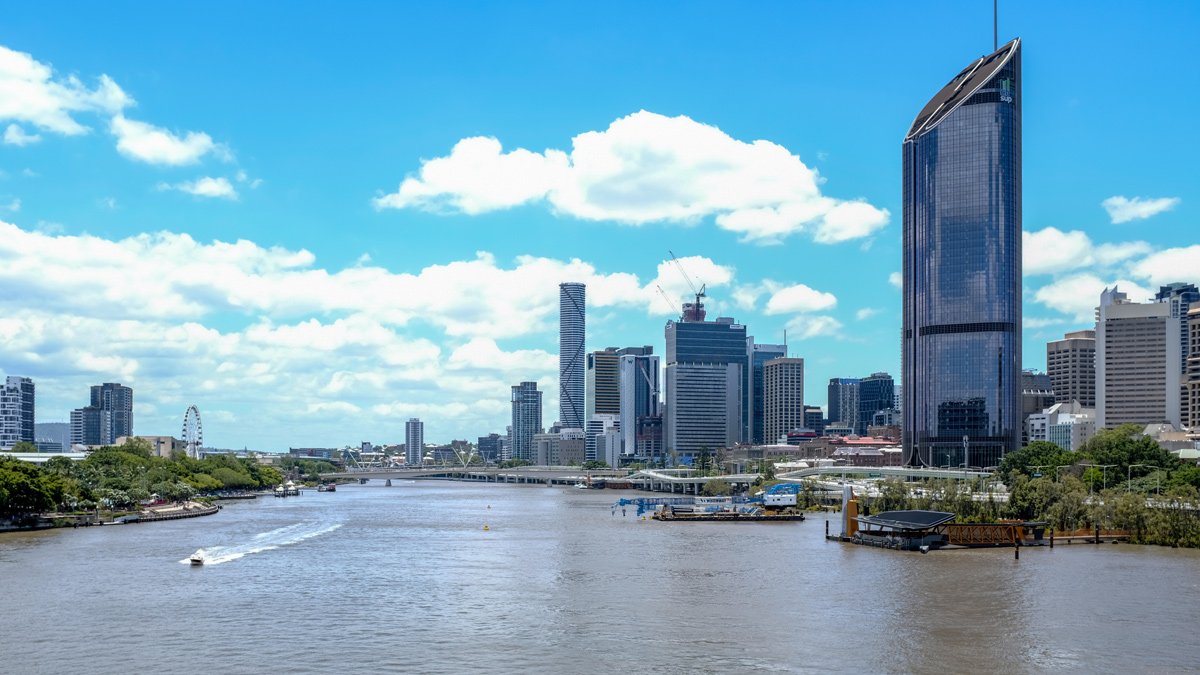 a city skyline with a body of water