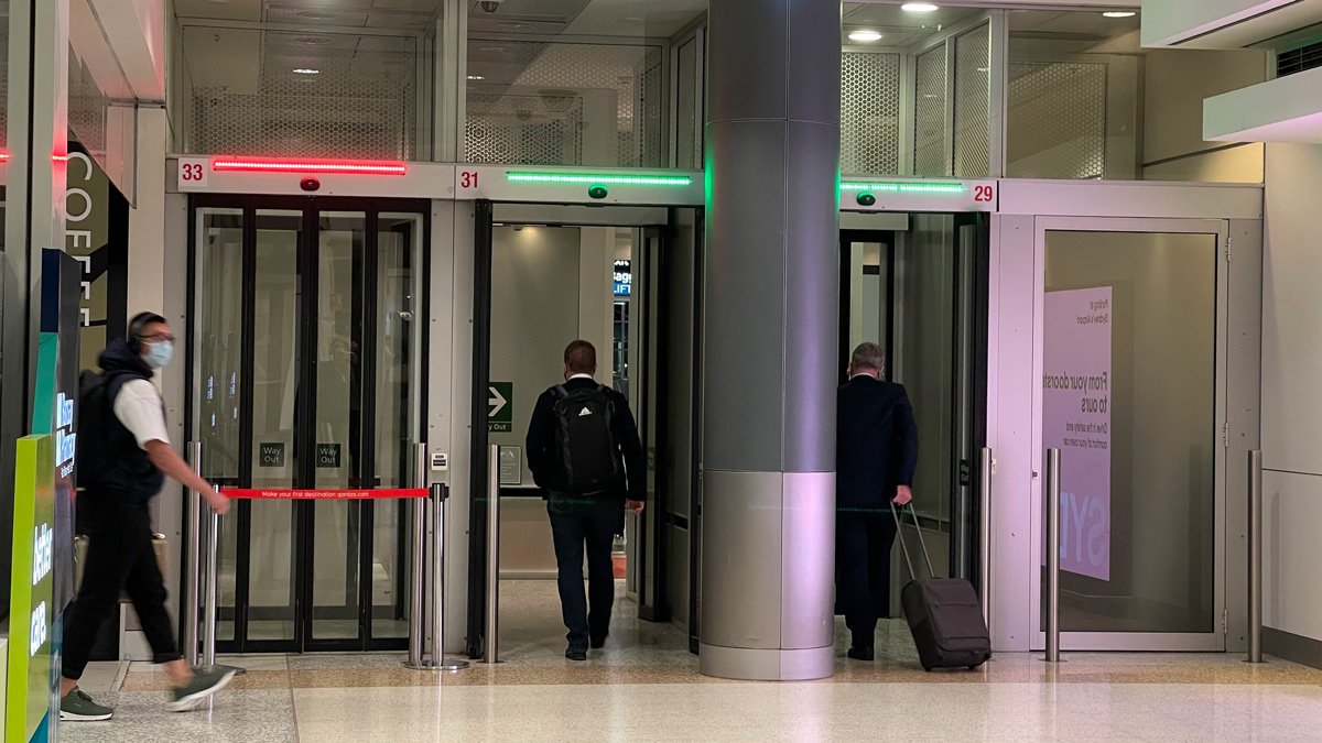 two men walking into an elevator