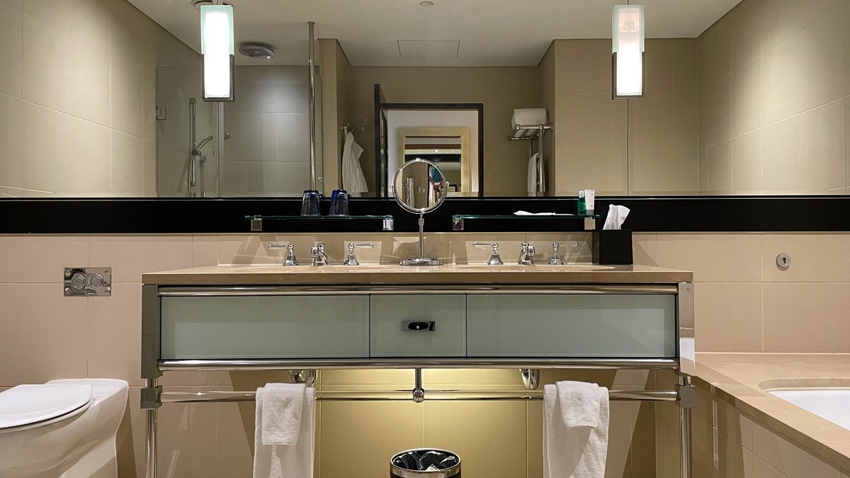 a bathroom with a mirror and a sink