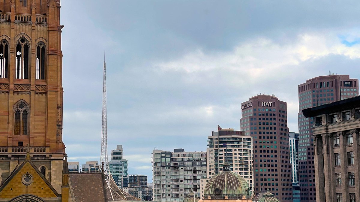 a city skyline with tall buildings