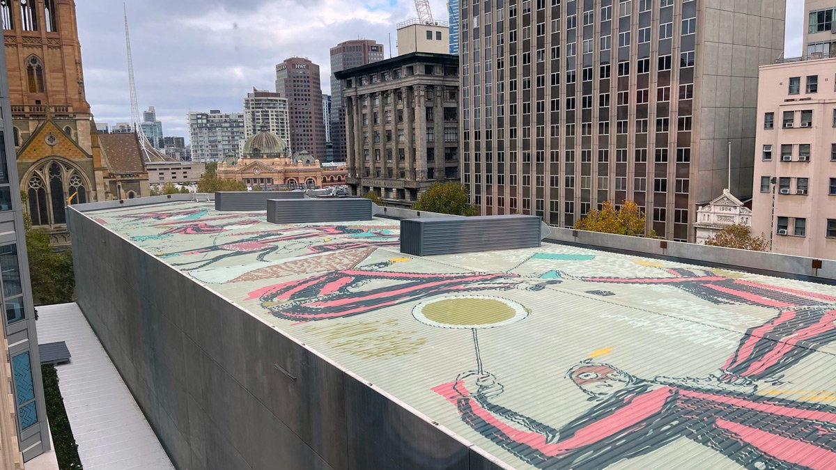 a rooftop with a painting on the roof