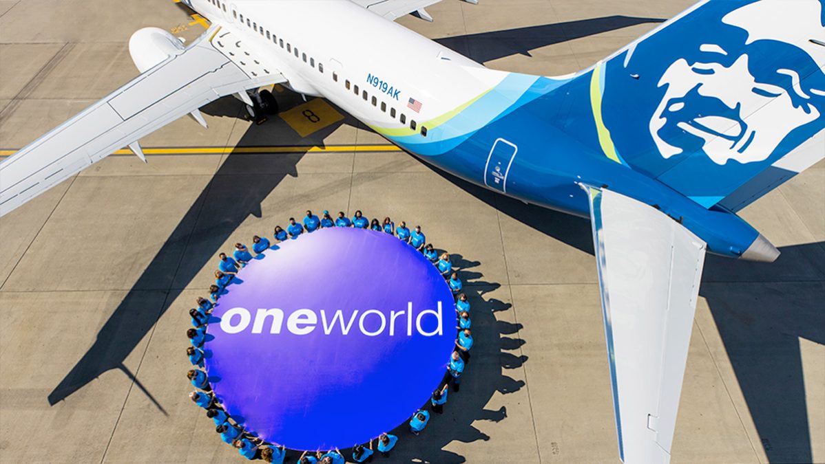 a group of people standing around a large circle with a large sign