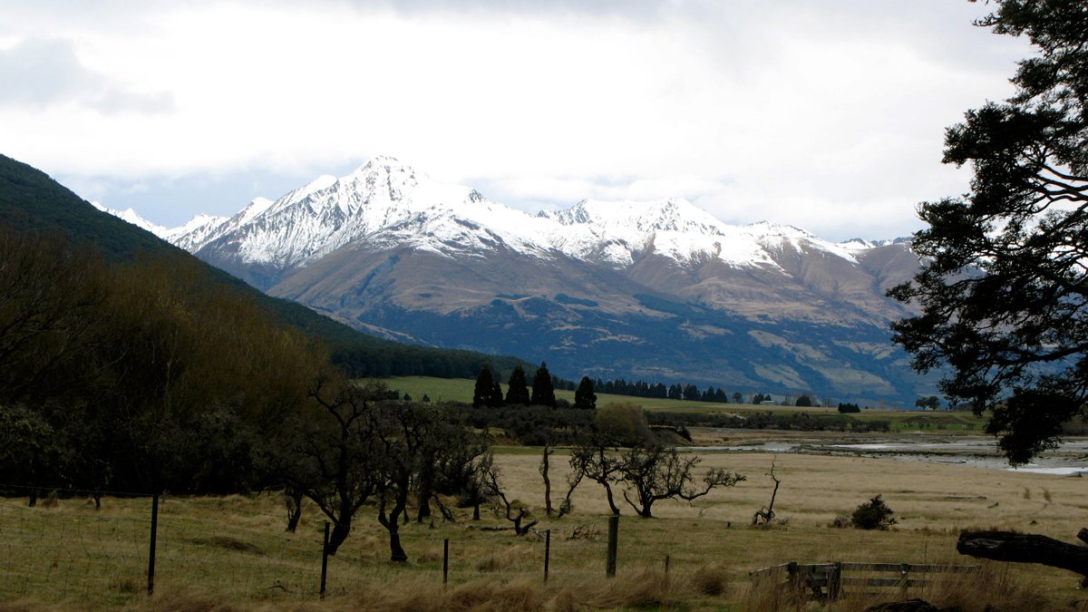 a snowy mountain range in the distance