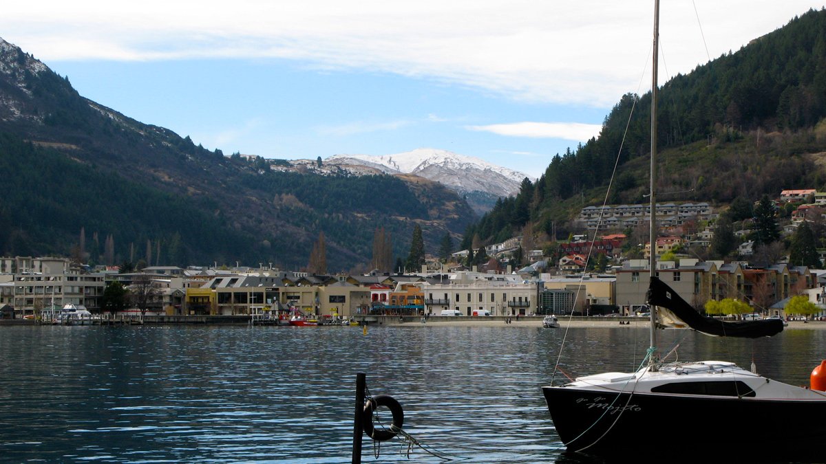 a boat on the water with Hallstatt in the background