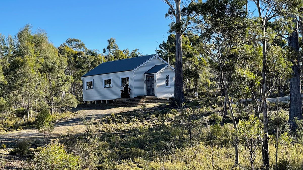 a white house in the woods