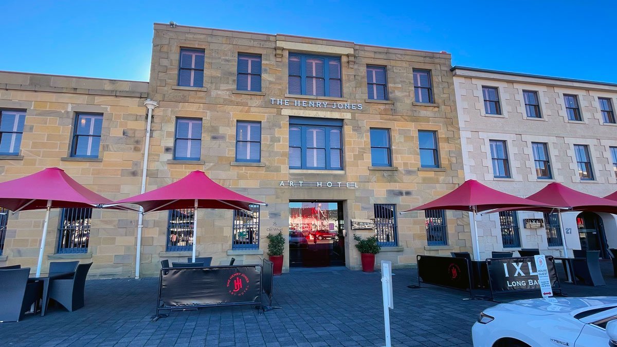 a building with red umbrellas