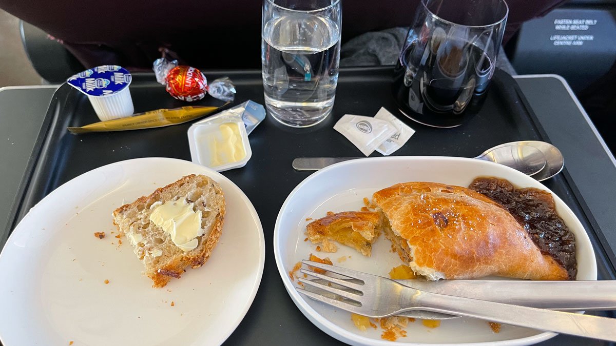 a plate of food and a fork on a tray