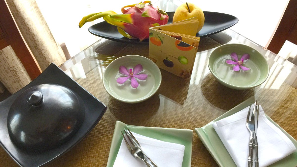 a table with plates and bowls with food on it