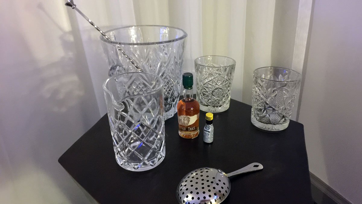 a group of glasses and a spoon on a table