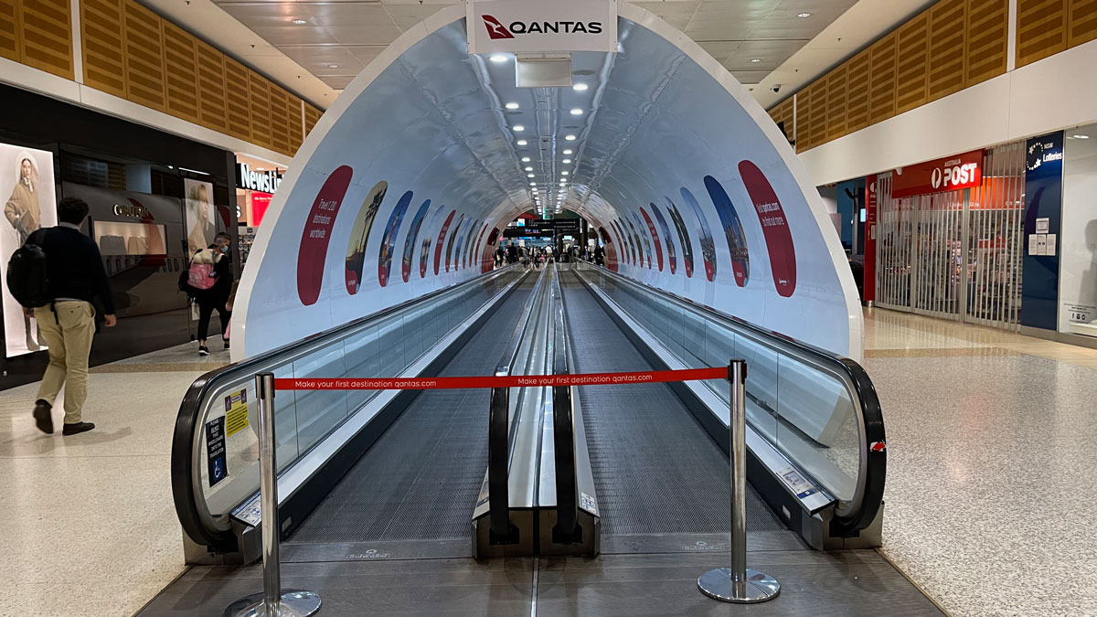 a white tunnel with a red tape around it