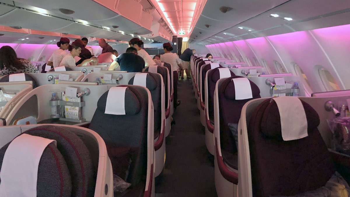 a group of people sitting in an airplane