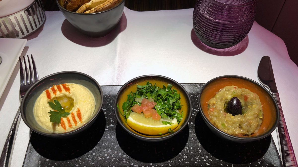 a row of bowls of food