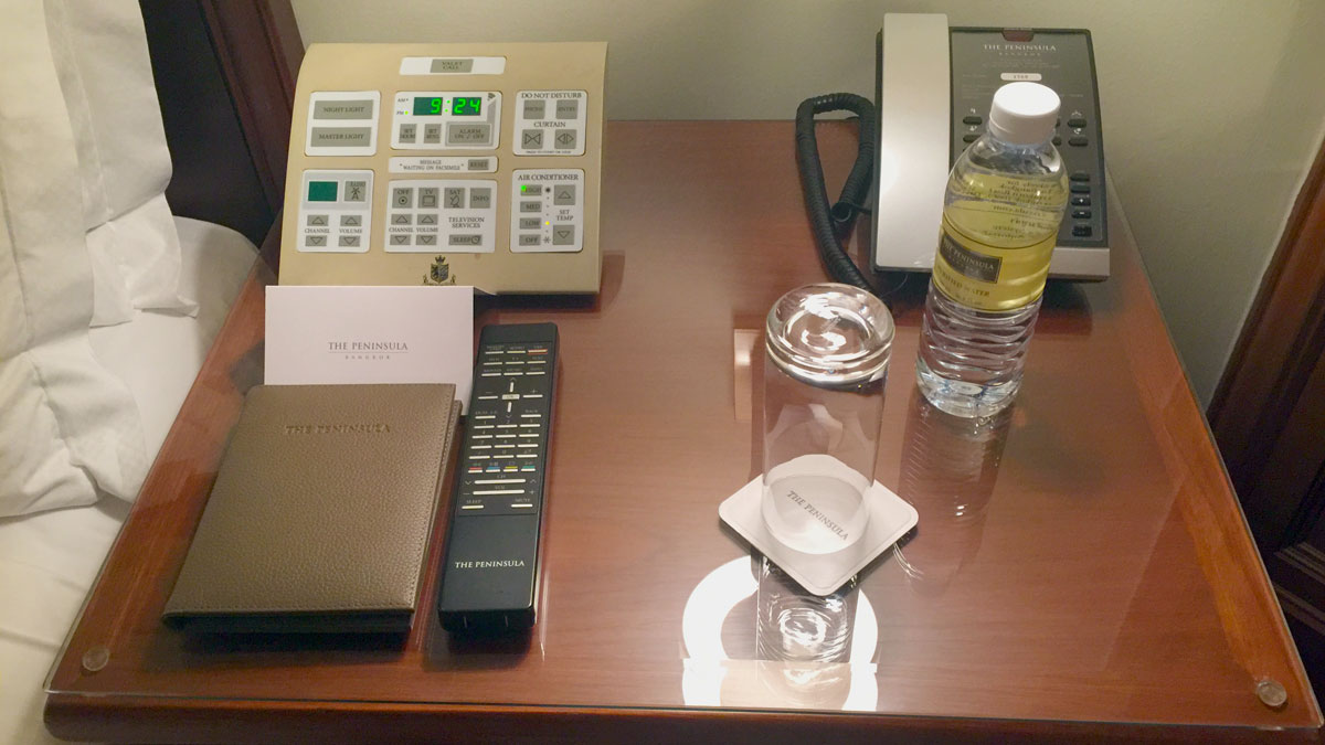 a phone and a bottle of water on a desk