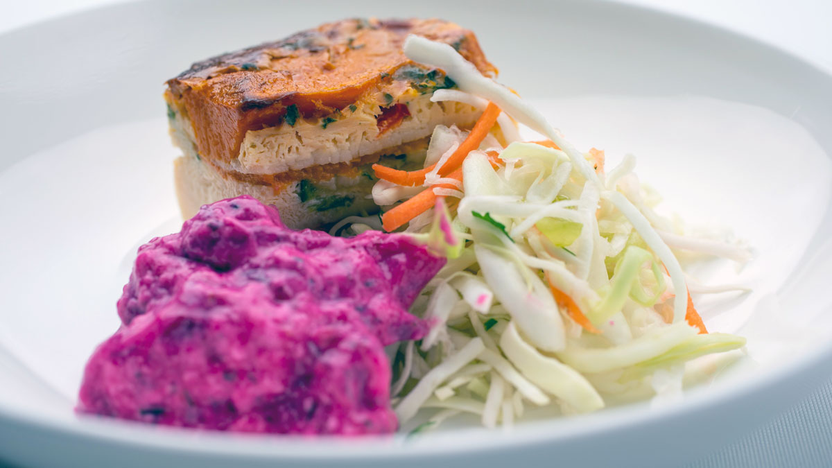 a plate of food on a white surface