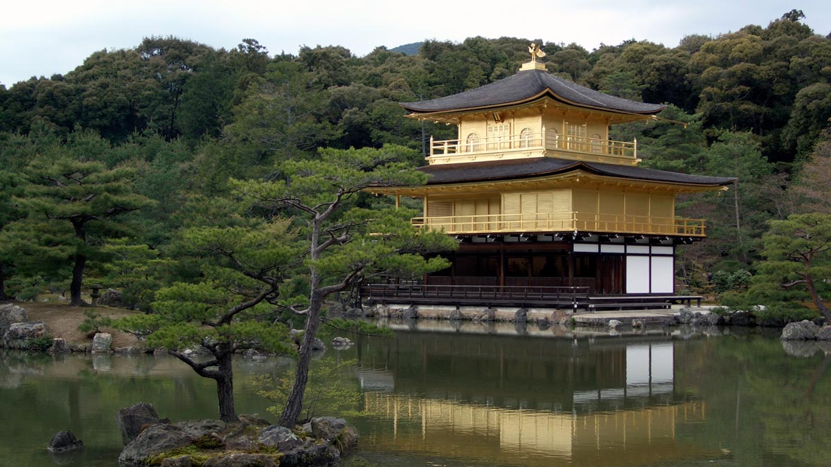Kinkaku-ji with a gold roof and a black roof surrounded by water