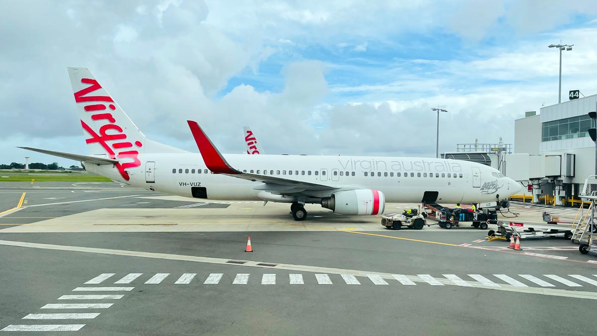 a white airplane on a runway