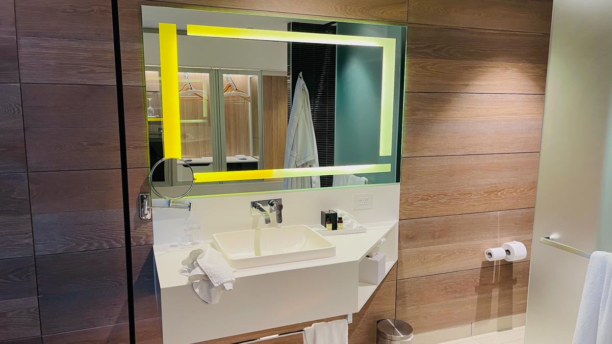 a bathroom with a mirror and sink