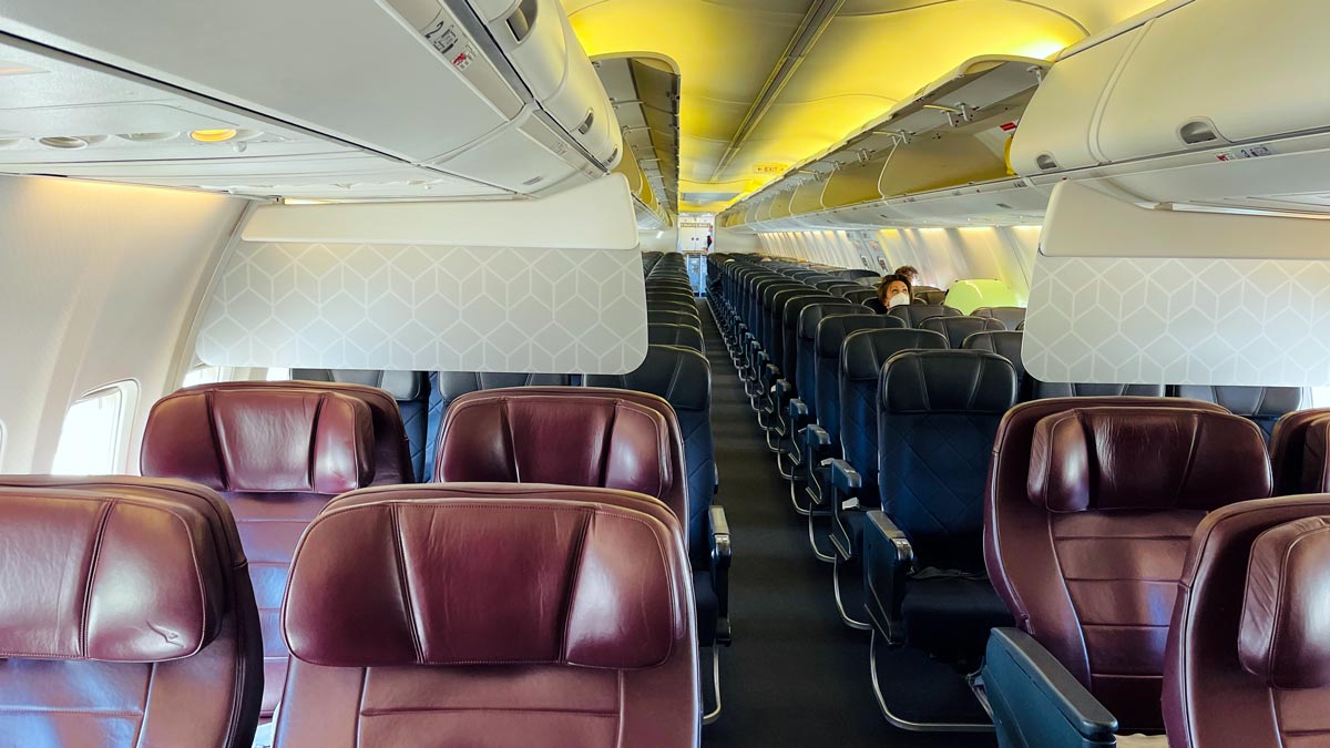 a plane with seats and a person sitting on it