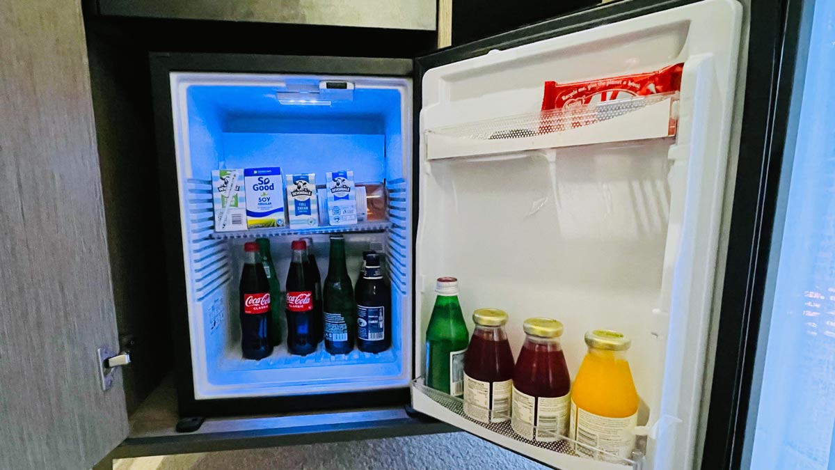 a mini fridge with drinks and beverages