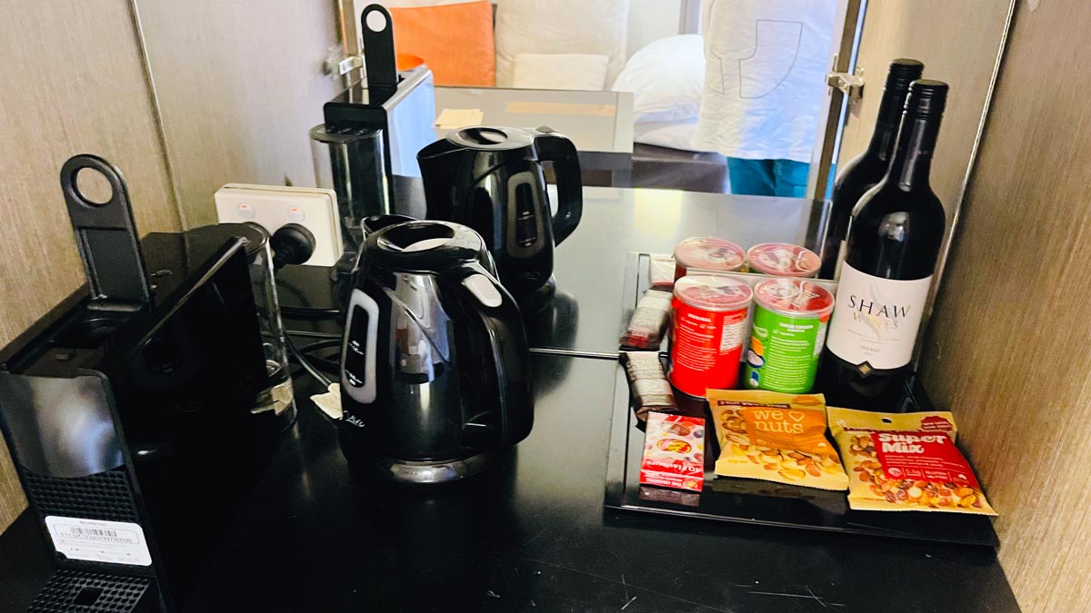 a coffee pot and food on a table