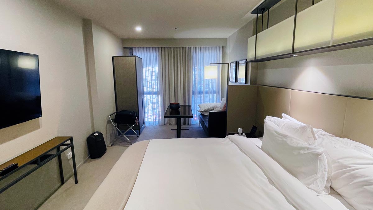 a hotel room with a bed and a table