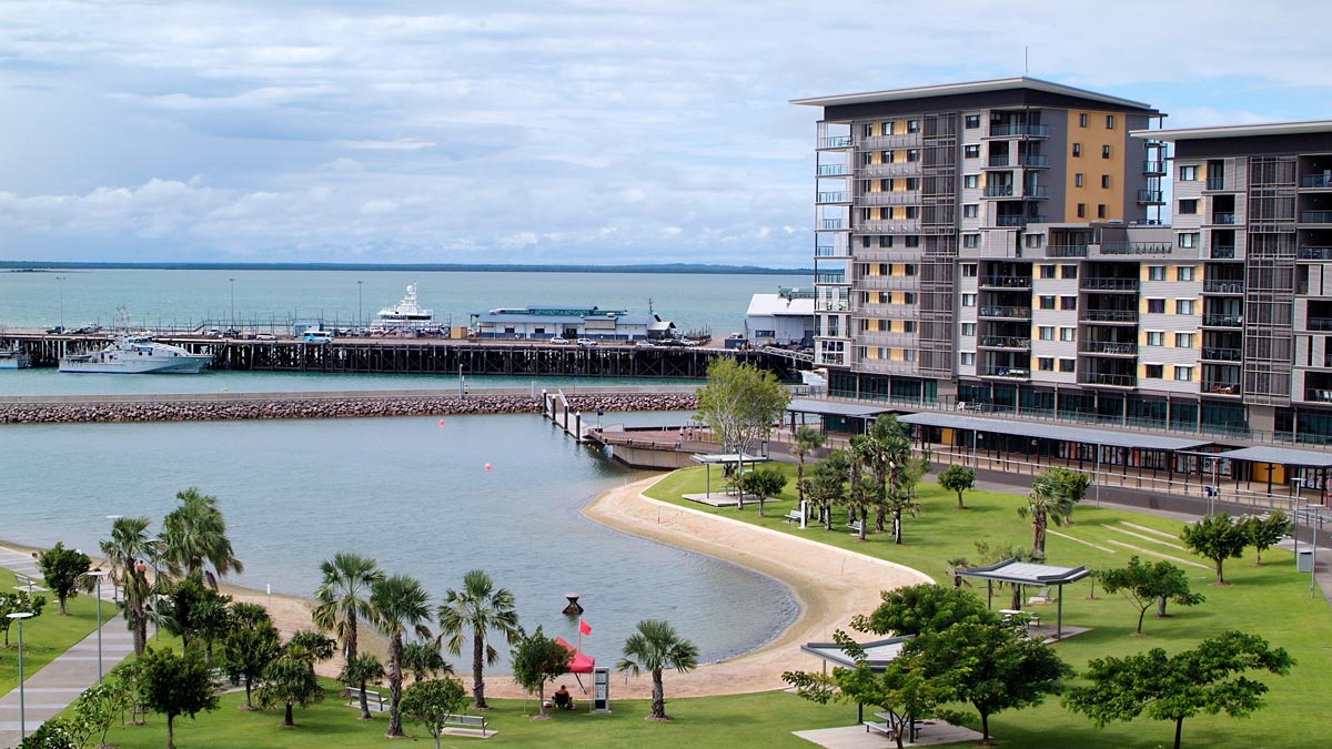 a body of water with a building and a pier