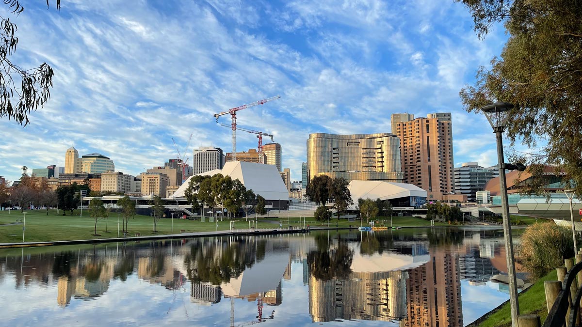 a body of water with a body of water with a large building in the background