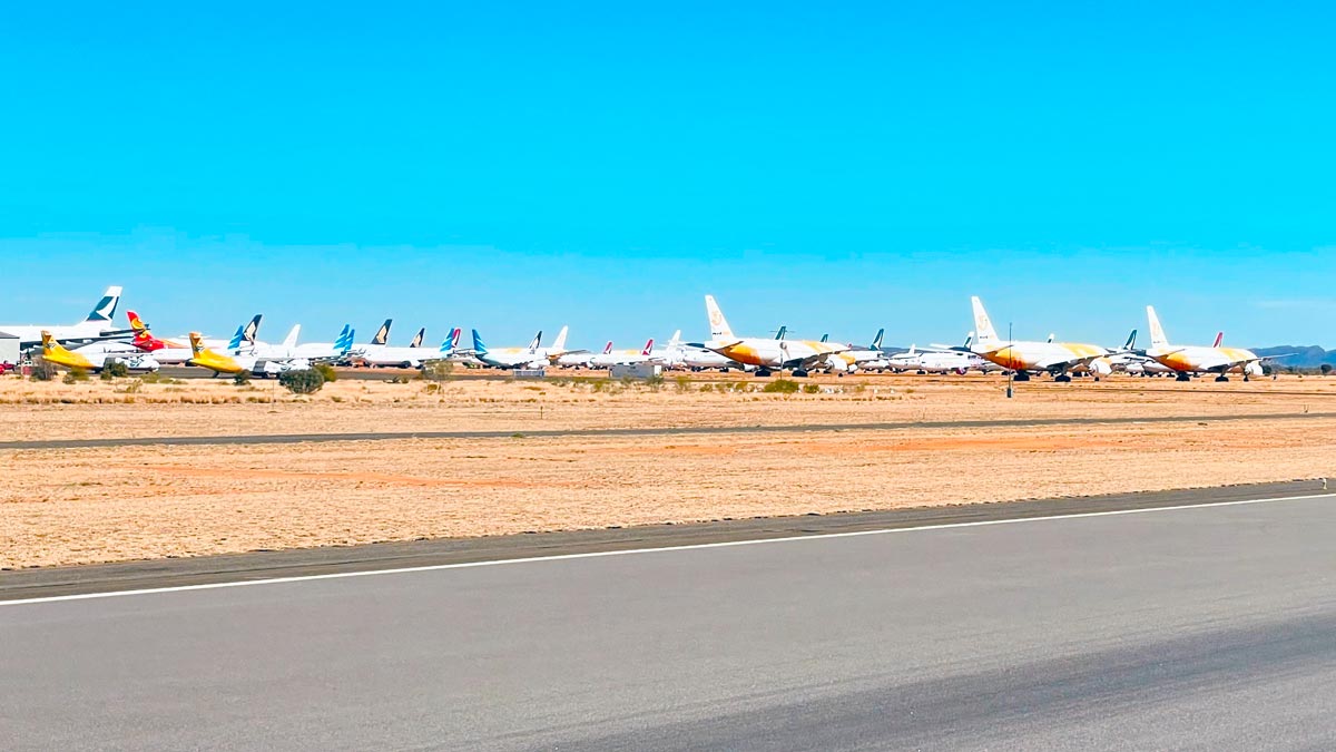 a group of airplanes on a runway