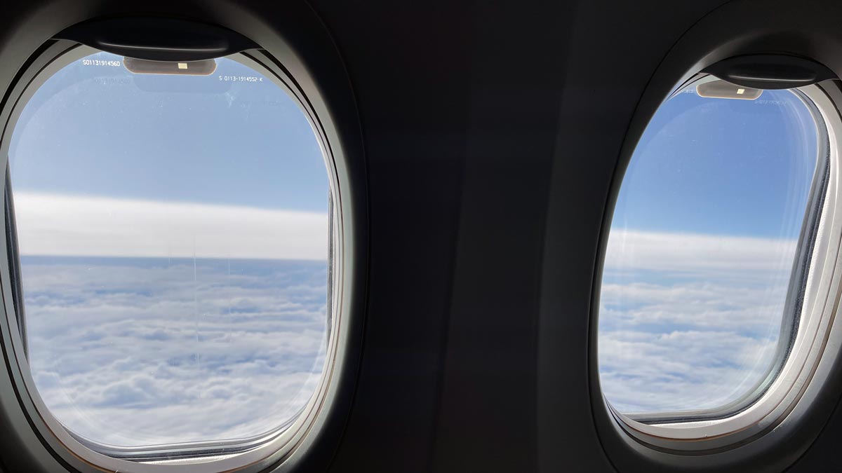 two windows with clouds and blue sky