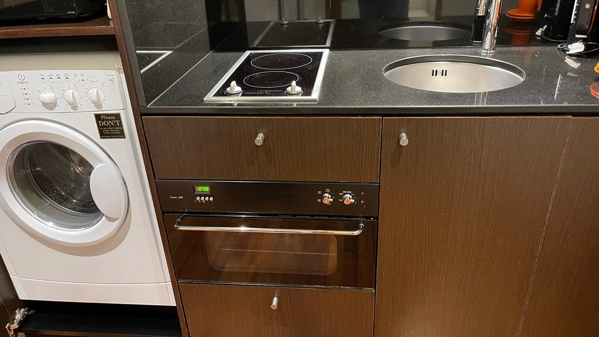 a kitchen countertop with a stove and oven